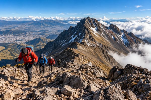 Hikers ascending Rucu Pichincha Volcano (4,794 m) near Quito, Ecuador, along rugged Andean mountain trails with spectacular volcanic peaks, panoramic views, and high-altitude landscapes.
